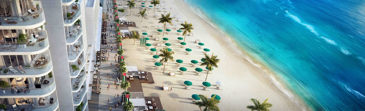 Emaar Beachfront from the sea: a row of towers on the island, the Dubai Marina skyline behind them